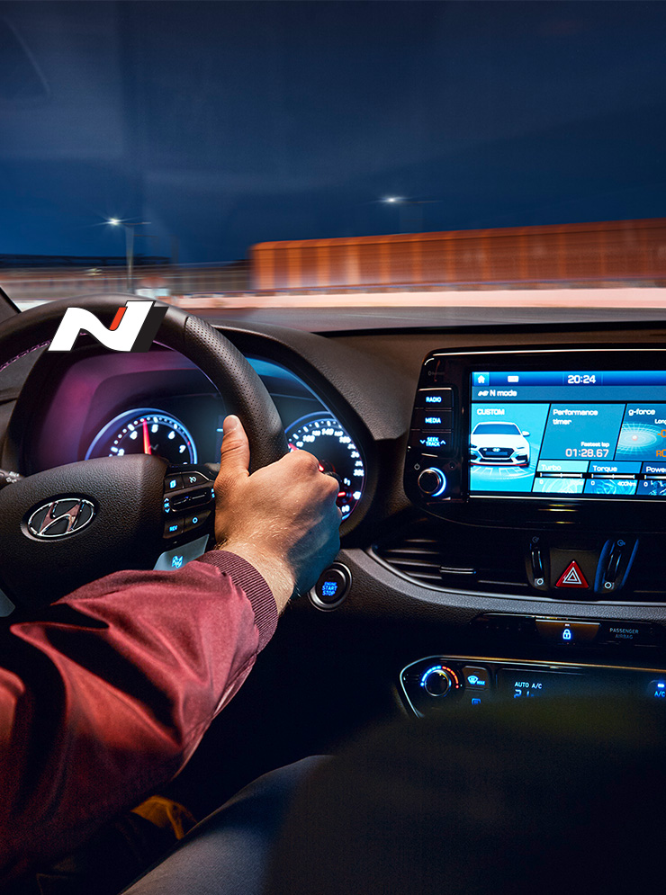 Front interior with man who grab the steering wheel