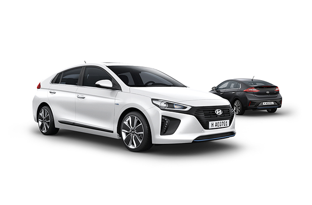 Side view of white Ioniq Hybrid in front and black Ioniq Hybrid parked behind